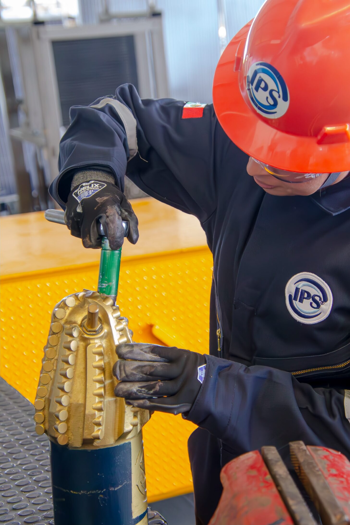 Technician working on a tricone bit