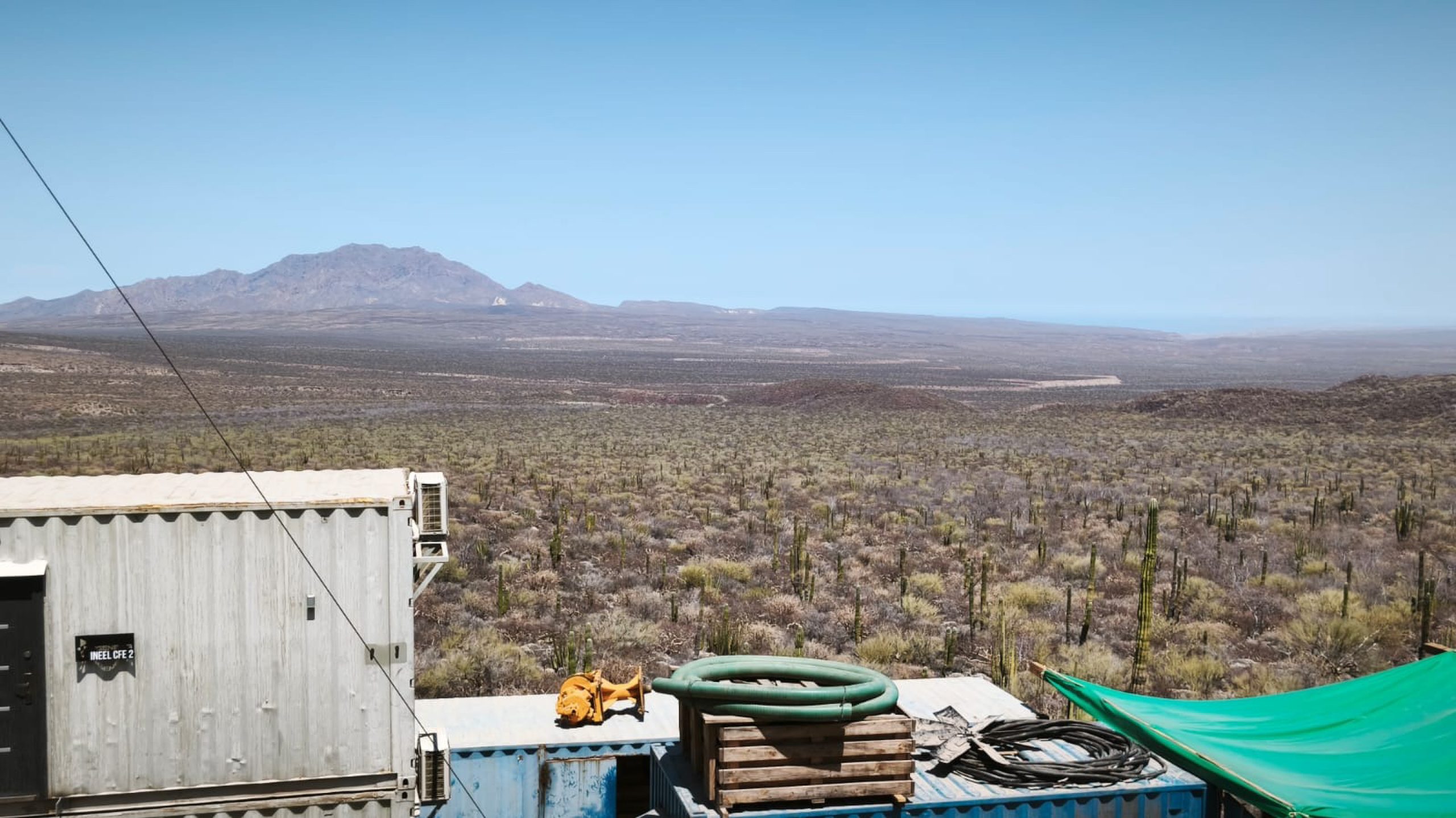 Arid geothermal field covered with cactus and scrubland