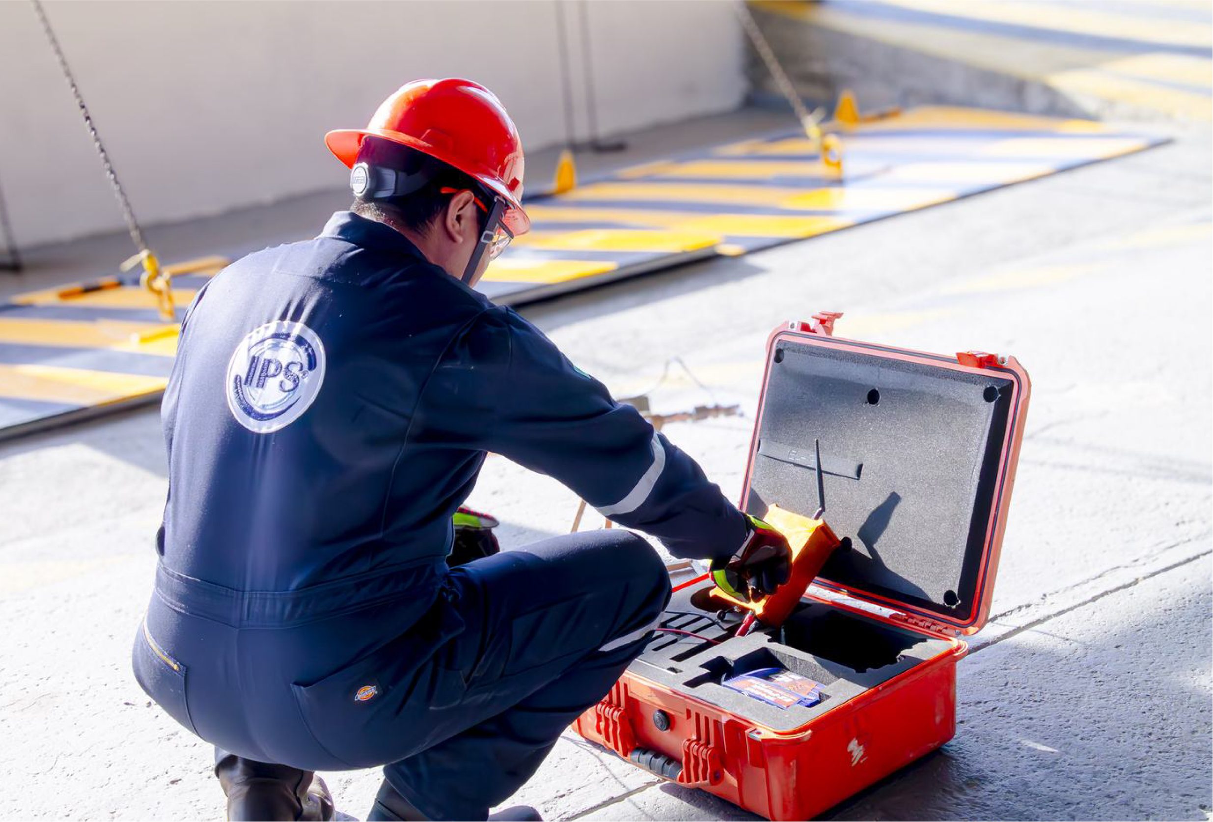 Technician preparing monitoring equipment from a field case