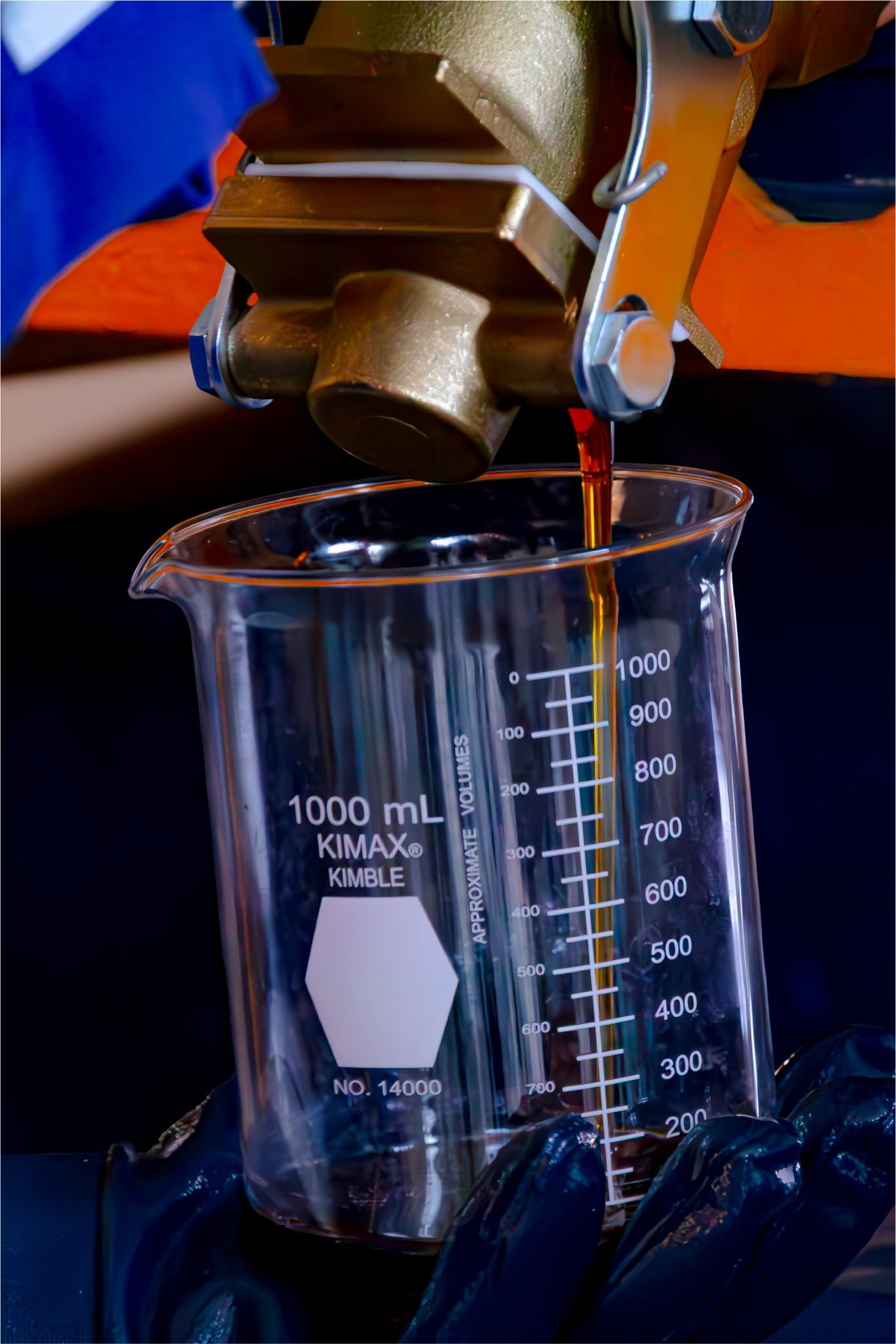 Acid system being poured into a laboratory beaker