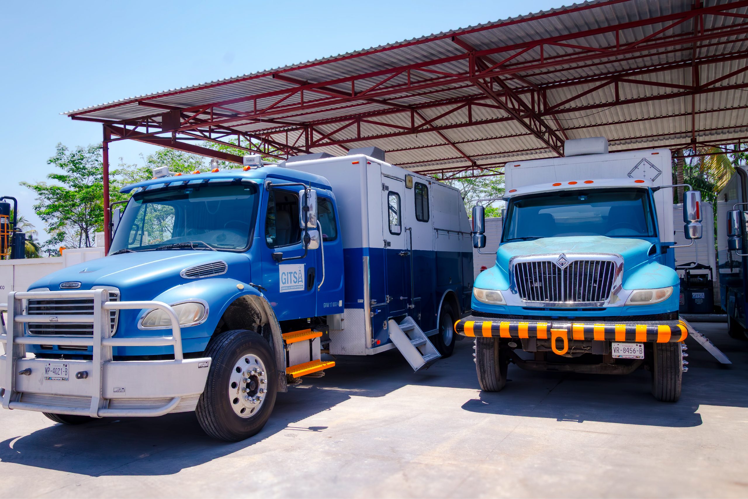 Wireline logging trucks parked at the base